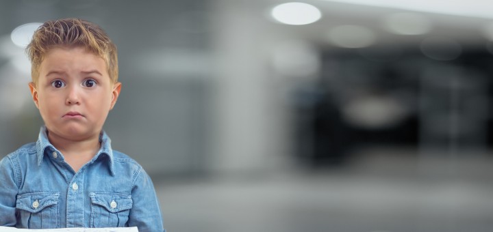 A little boy looks on in disbelief